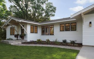 andersen a series black windows with short fractional grids and white james hardie siding