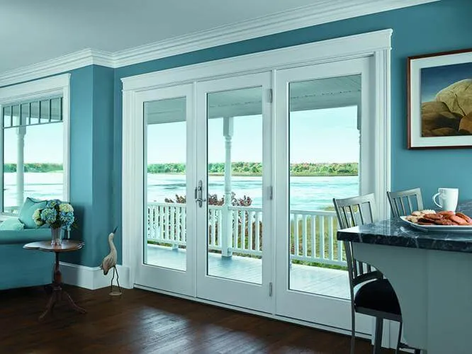 Andersen-Aluminum-Clad-Wood-Doors-1 White aluminum-clad wood French doors opening to a waterfront porch