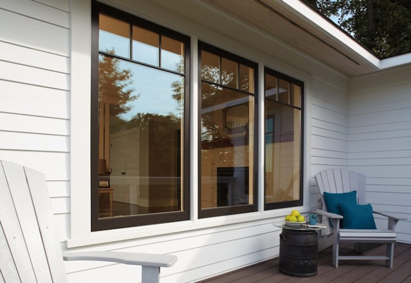 andersen-a-series-black-windows-with-sdl-grids-with-white-james-hardie-siding