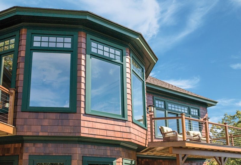 andersen-a-series-green-windows-with-tall-fractional-grids-and-wood-shake-siding