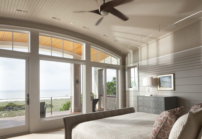 arched-window-and-patio-door-unit-in-a-bedroom