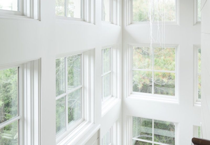 light-filled-stairwell-with-white-windows-and-sdl-grids