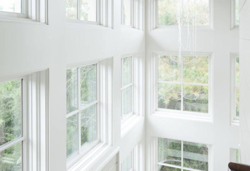 light-filled-stairwell-with-white-windows-and-sdl-grids
